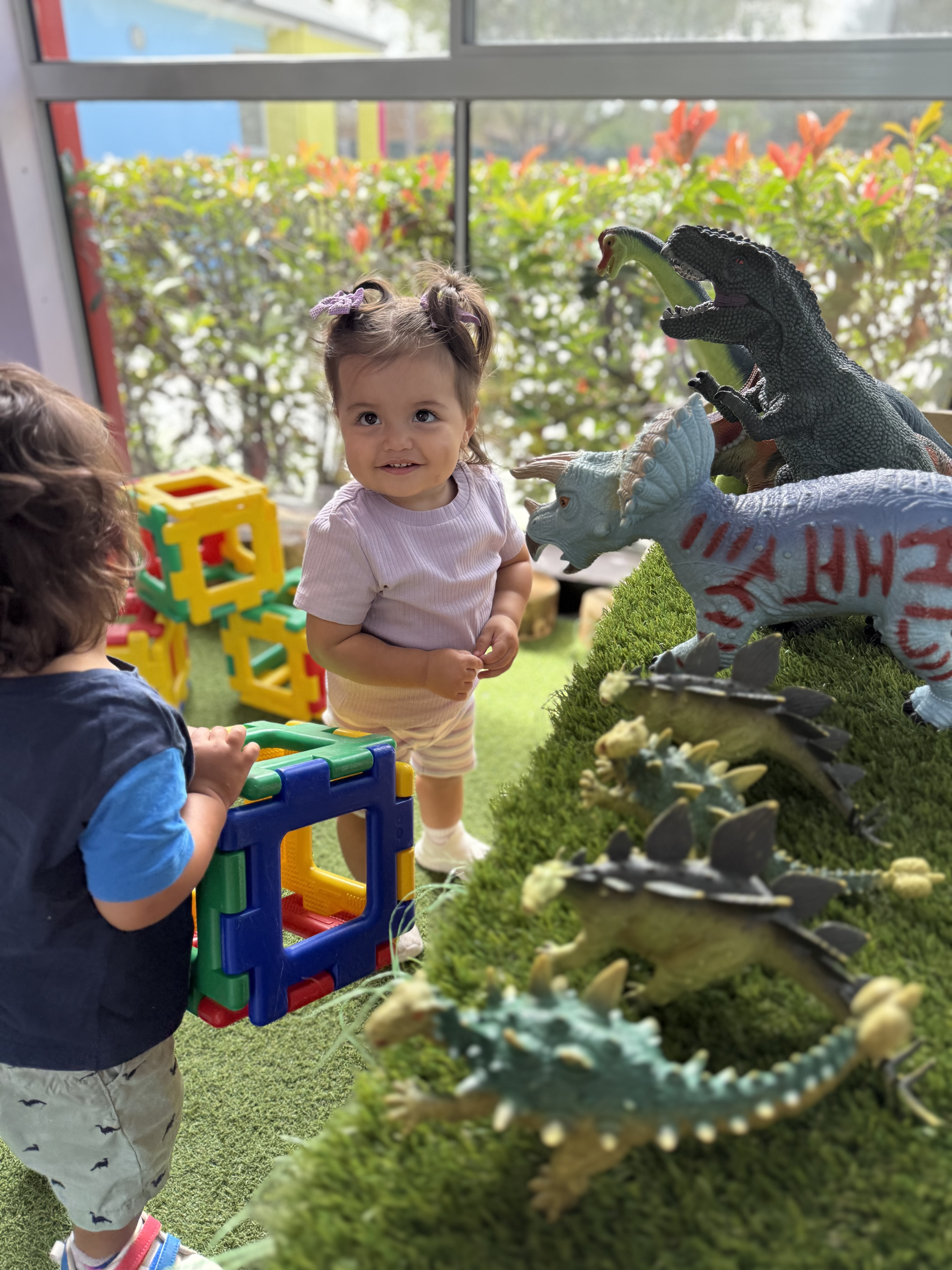 Infants exploring sensory activities in a safe and nurturing environment.